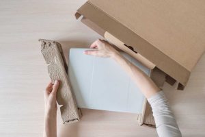 hands-unboxing-new-laptop-by-stanislav71-via-shutterstock-1.jpg