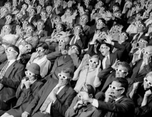 3481488-0-10640100-1723197772-high-angle-view-of-group-of-spectators-sitting-in-a-movie-theater-wearing-3-d-glasses-79072701-100265299-orig.jpg